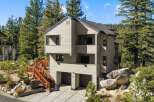 Nestled amidst towering pine trees, this multi-level home offers a serene mountain retreat.