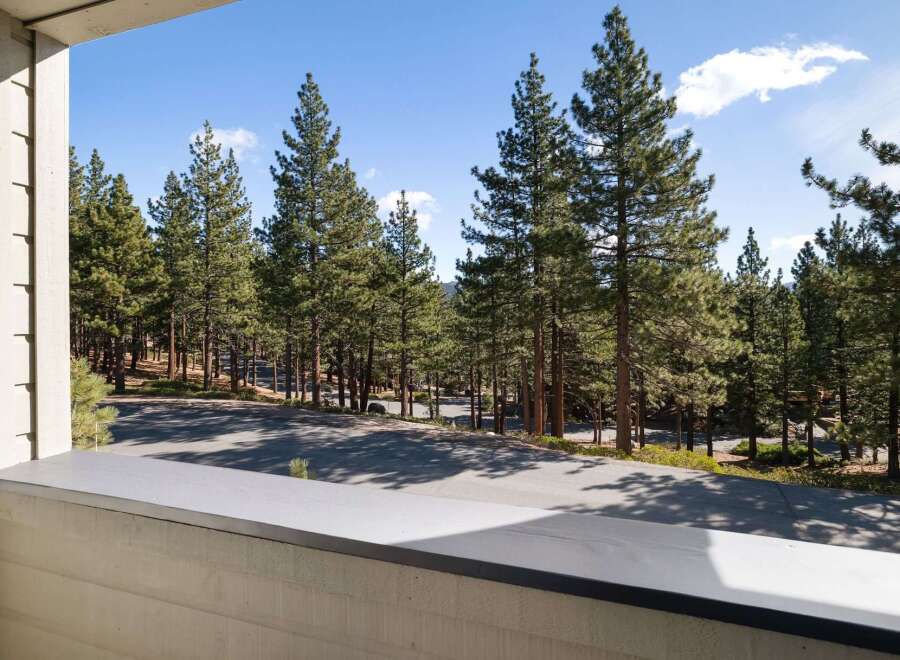 Enjoy the serene mountain views from this property, surrounded by majestic pine trees.