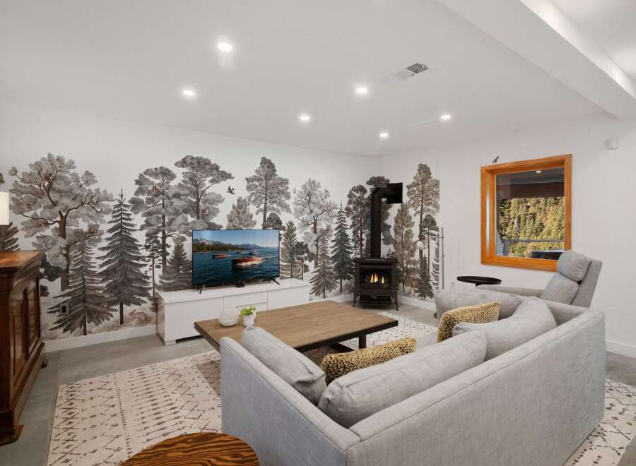 Experience rustic charm in this inviting living room, featuring a striking forest-themed mural that brings the outdoors in.