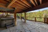 Enjoy the ultimate relaxation with this spacious outdoor patio, featuring a luxurious hot tub perfect for unwinding after a long day.