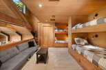 This spacious loft bedroom features multiple built-in bunk beds, perfect for accommodating family and friends.