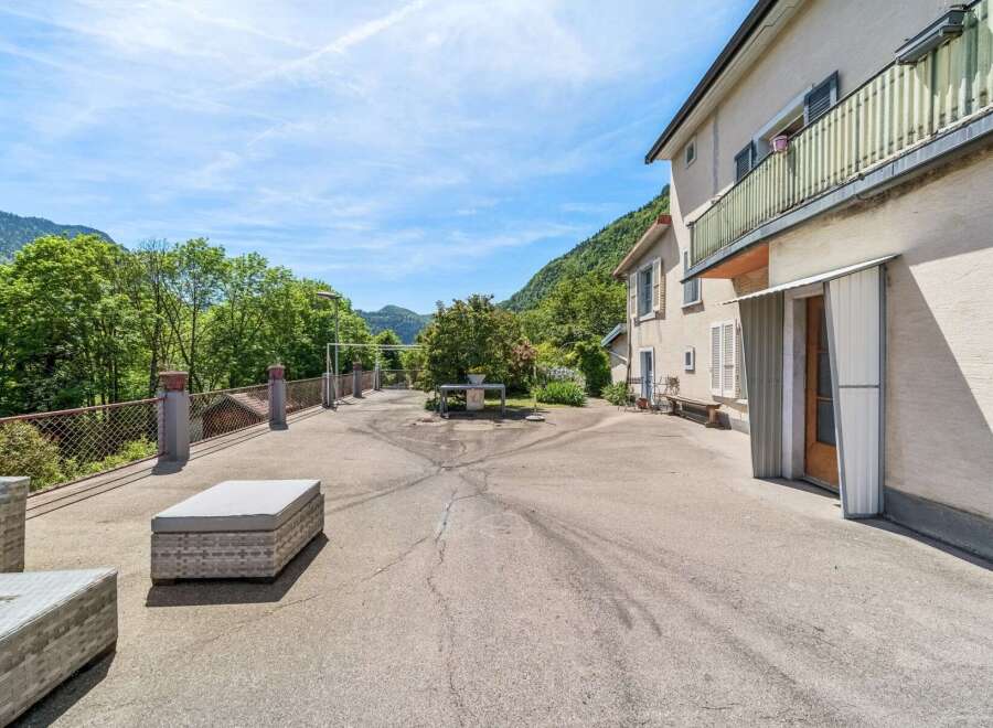 Enjoy the stunning mountain views from this property's spacious outdoor area, perfect for relaxation and entertaining.
