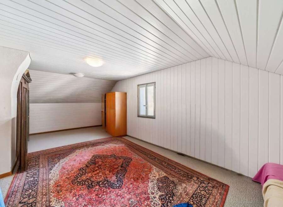 Discover this charming attic room, perfect for a cozy retreat or extra living space.