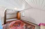 Discover this charming attic room, perfect for a cozy retreat or extra living space.