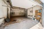 Discover this spacious garage, perfect for vehicle storage or as a workshop.