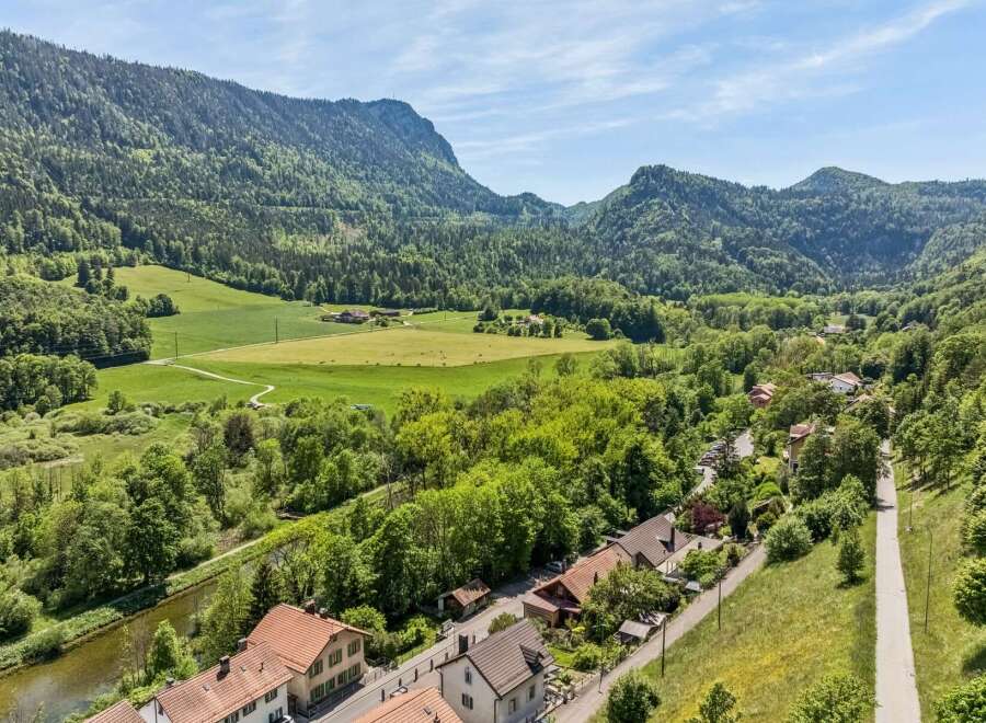 Nestled in a picturesque valley, this property offers a serene escape with stunning mountain views and lush green landscapes.