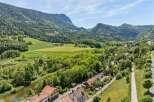 Nestled in a picturesque valley, this property offers a serene escape with stunning mountain views and lush green landscapes.