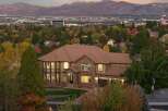 Experience luxury living in this stunning multi-story home, nestled amidst vibrant autumn foliage.
