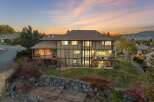 Experience luxury living in this stunning multi-level home, perfectly situated on a hillside with breathtaking sunset views.