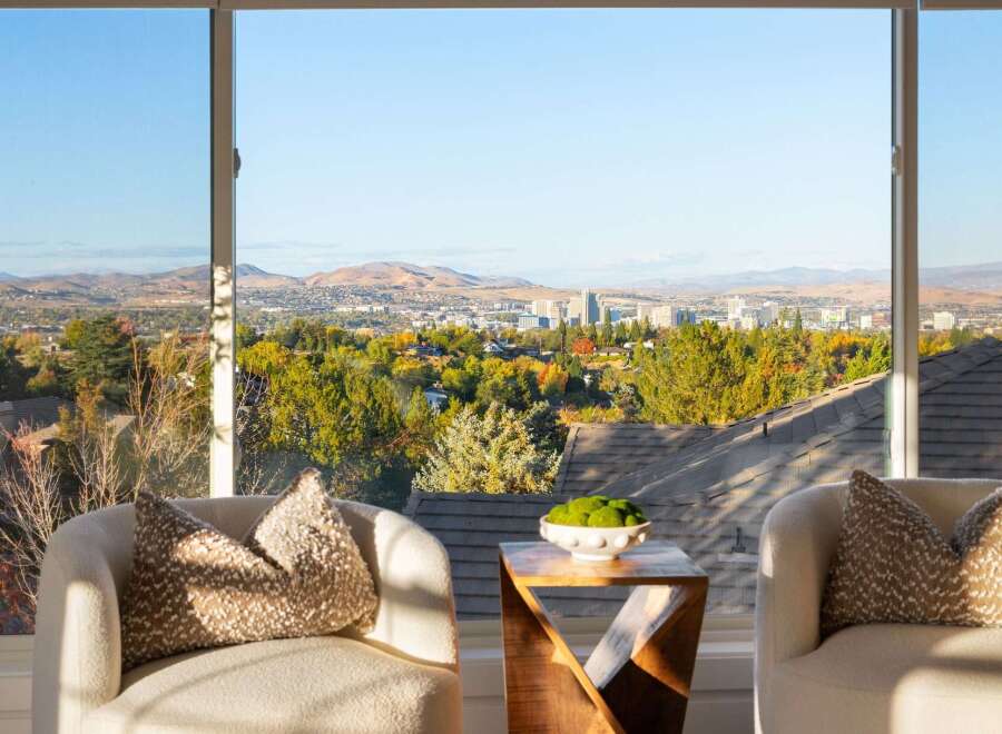 Experience breathtaking panoramic views of the city and mountains from this stunning property.