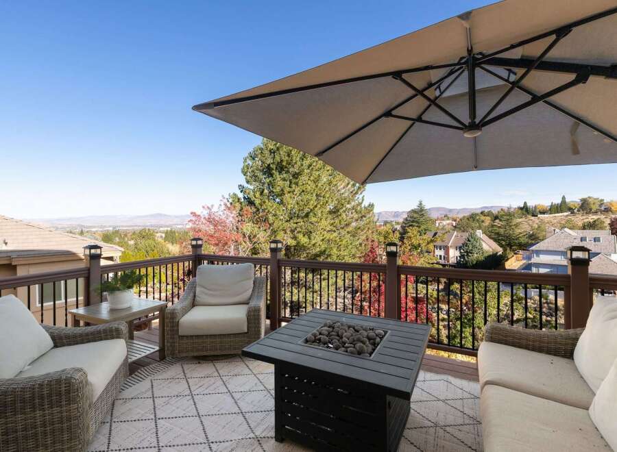 Enjoy breathtaking panoramic views from this expansive deck, perfect for entertaining or relaxing.