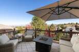 Enjoy breathtaking panoramic views from this expansive deck, perfect for entertaining or relaxing.
