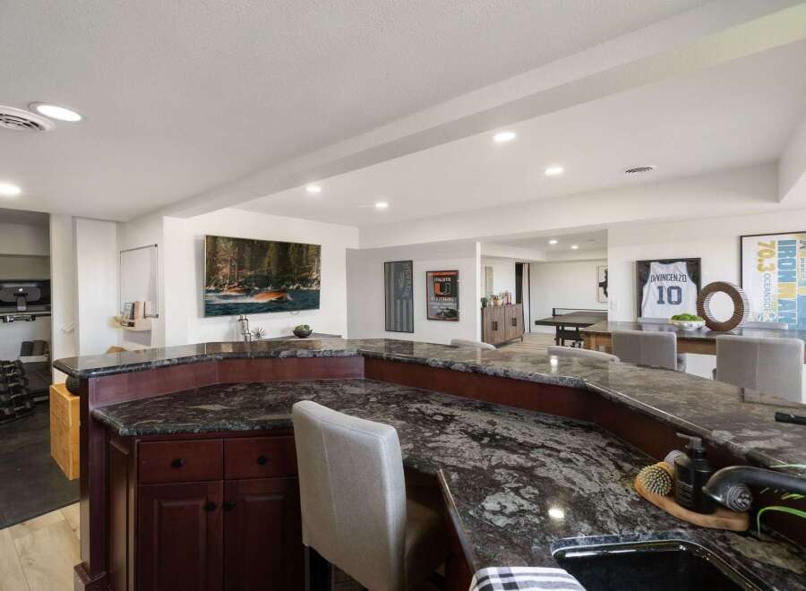 Step into this versatile finished basement, perfect for entertainment and fitness.