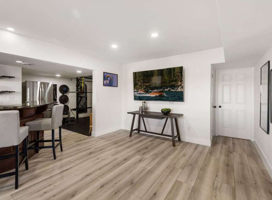 This versatile finished basement offers a complete entertainment and fitness space.