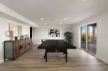 This modern basement offers a perfect blend of recreation and relaxation.