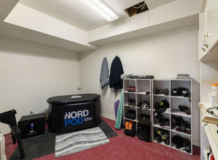 This home gym space is equipped for recovery and training, featuring a NORD POD Elite for cold therapy and a Polar Dive unit.