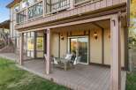 Enjoy outdoor living on this spacious deck, perfect for entertaining or relaxing.