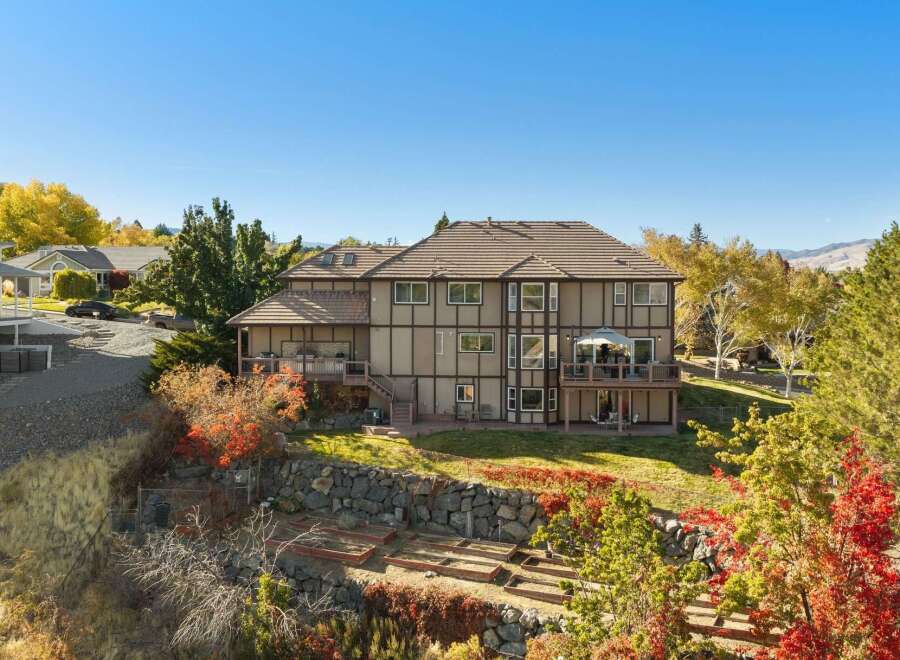 This stunning multi-level home boasts expansive decks perfect for entertaining and enjoying the scenic views.
