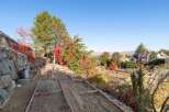 Discover the potential of this expansive property, featuring a tiered garden with raised beds perfect for cultivating your own produce.