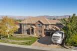 This stunning multi-story brick home offers breathtaking panoramic views of the surrounding mountains and city.
