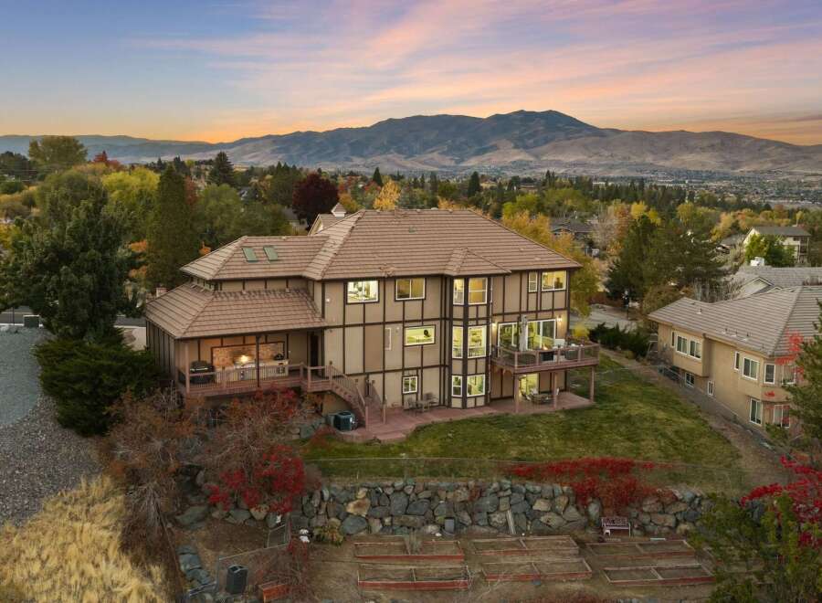 Experience luxury living with this stunning multi-level home, boasting expansive decks and patios perfect for entertaining or enjoying the breathtaking mountain views.