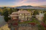 Experience luxury living with this stunning multi-level home, boasting expansive decks and patios perfect for entertaining or enjoying the breathtaking mountain views.