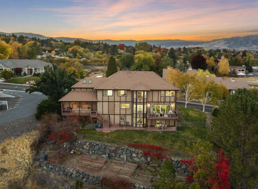Experience luxury living in this stunning multi-level home, perfectly situated to capture breathtaking sunset views.
