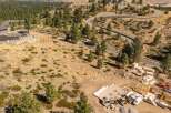 Experience luxury living with this stunning custom home construction nestled in a serene, wooded landscape.
