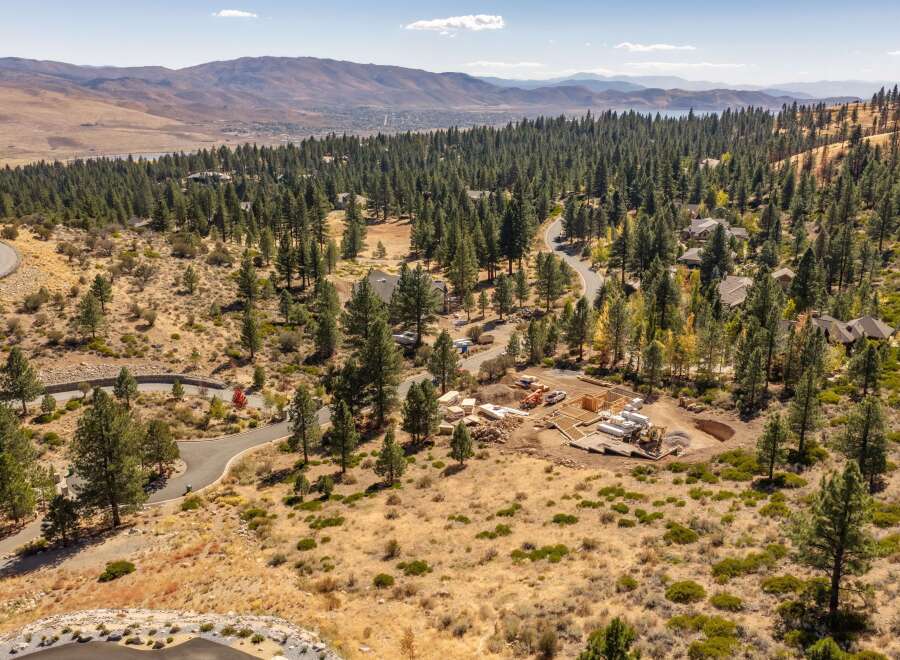Discover your dream home in this picturesque setting, nestled among mature pine trees with stunning mountain views.