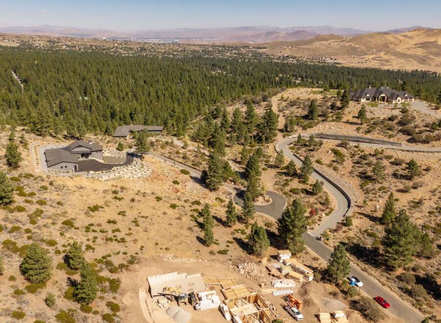 Discover luxury living in this expansive estate, nestled amidst a serene forest with breathtaking mountain views.