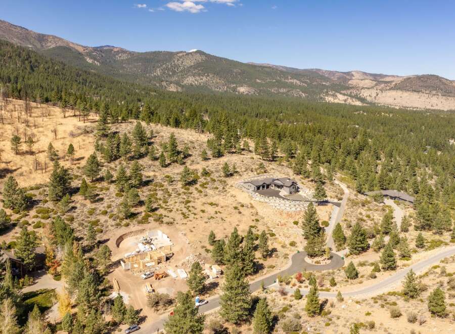 Discover your dream home nestled in a serene mountain landscape.