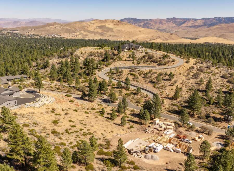 Experience luxury living in this expansive estate, nestled amidst rolling hills and mature pine trees.