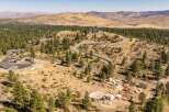 Experience luxury living in this expansive estate, nestled amidst rolling hills and mature pine trees.