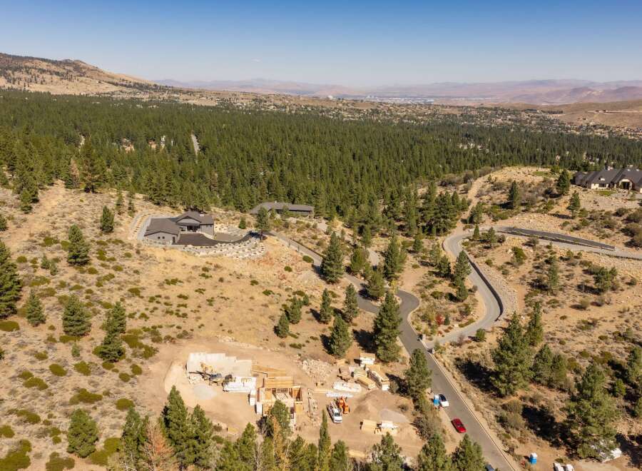Experience luxury living in this expansive estate nestled amidst a serene pine forest.