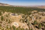 Experience luxury living in this expansive estate nestled amidst a serene pine forest.
