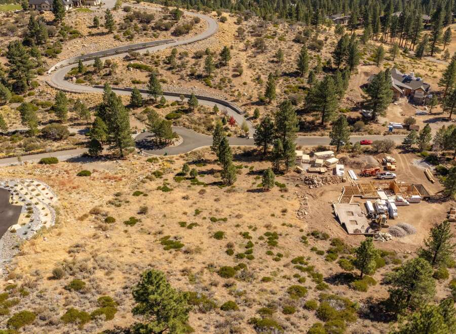 Discover this stunning new construction home nestled in a picturesque, wooded hillside setting.