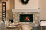 Cozy mountain chalet with a stone fireplace, creating a warm and inviting atmosphere.