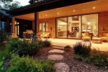 This stunning property boasts a spacious covered patio, perfect for outdoor entertaining, with a built-in grill and comfortable seating.