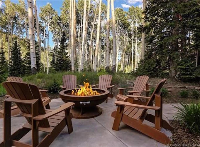 Cozy up by the fire pit in your private aspen grove.