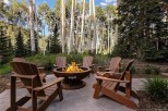 Cozy up by the fire pit in your private aspen grove.