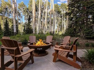 Cozy up by the fire pit in your private aspen grove.
