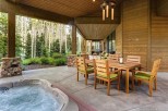 This stunning property boasts a spacious outdoor patio with a hot tub, perfect for relaxation and entertaining.