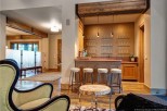 This stunning home boasts a custom wet bar, perfect for entertaining guests.