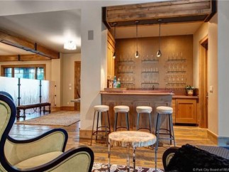 This stunning home boasts a custom wet bar, perfect for entertaining guests.