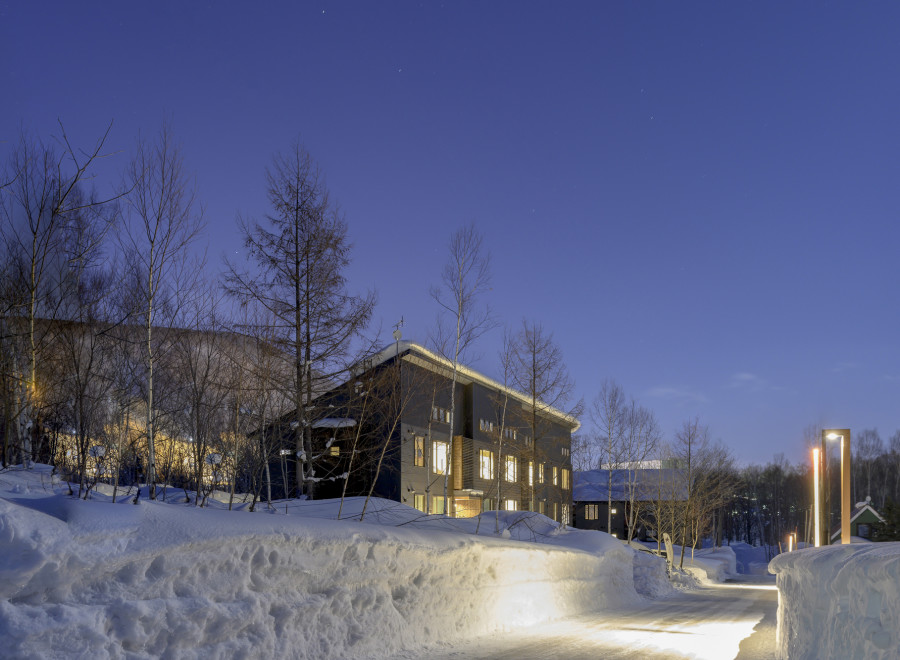 Luxury lodge nestled in a snowy landscape, offering breathtaking views and serene ambiance.