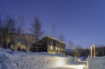 Luxury lodge nestled in a snowy landscape, offering breathtaking views and serene ambiance.