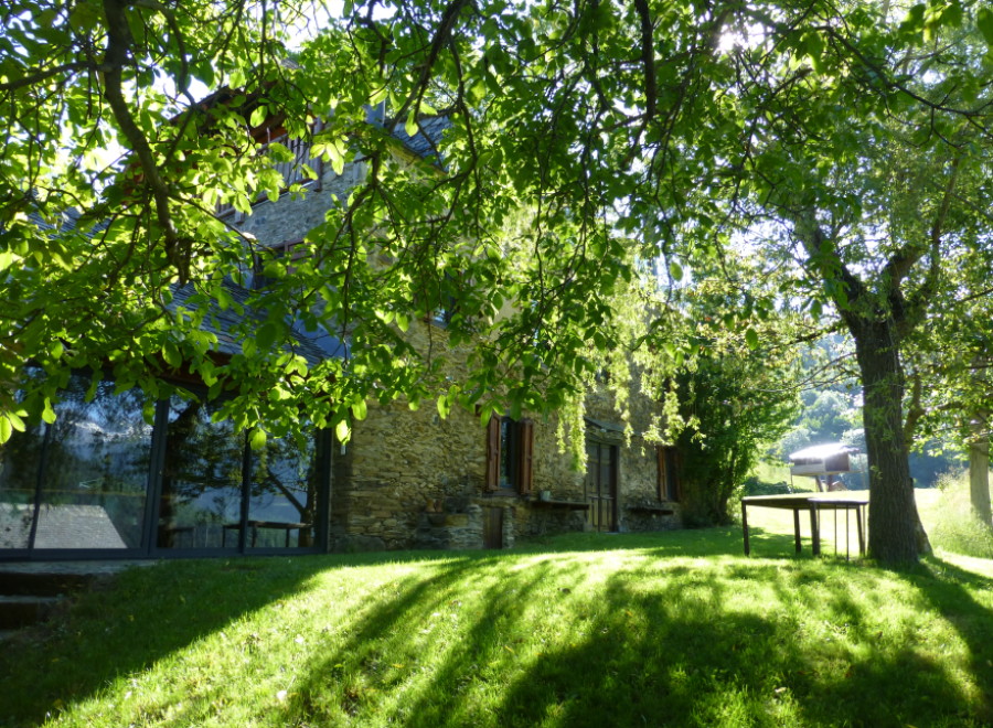 Nestled amidst lush greenery, this charming stone house offers a tranquil escape.
