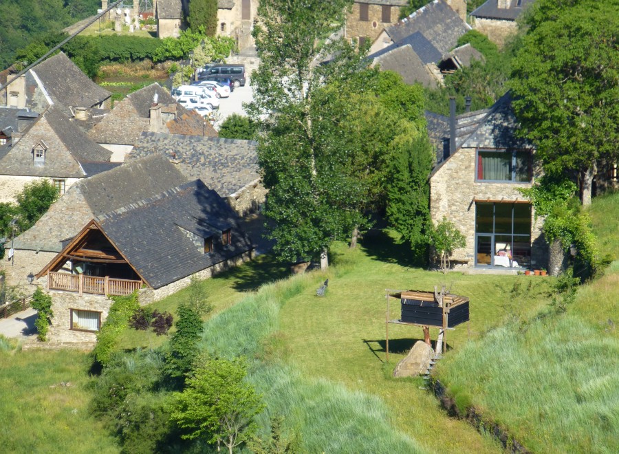 This charming stone house boasts a spacious balcony, large windows offering stunning views, and a private garden.
