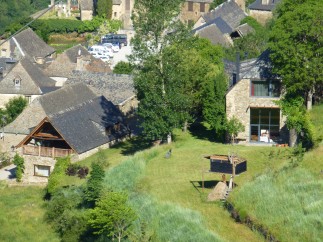 This charming stone house boasts a spacious balcony, large windows offering stunning views, and a private garden.