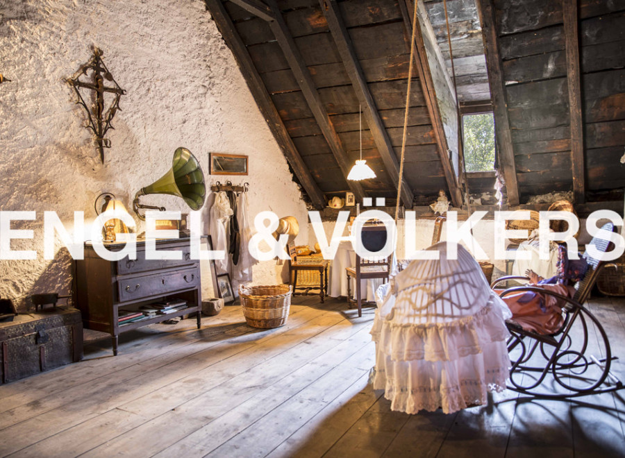 Discover this unique attic space, brimming with rustic charm and character.